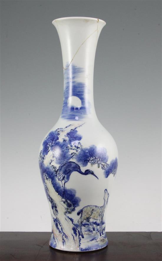 A Chinese underglaze blue and copper red crane and deer bottle vase, Kangxi six character mark, early 20th century, 39.5cm., neck rep